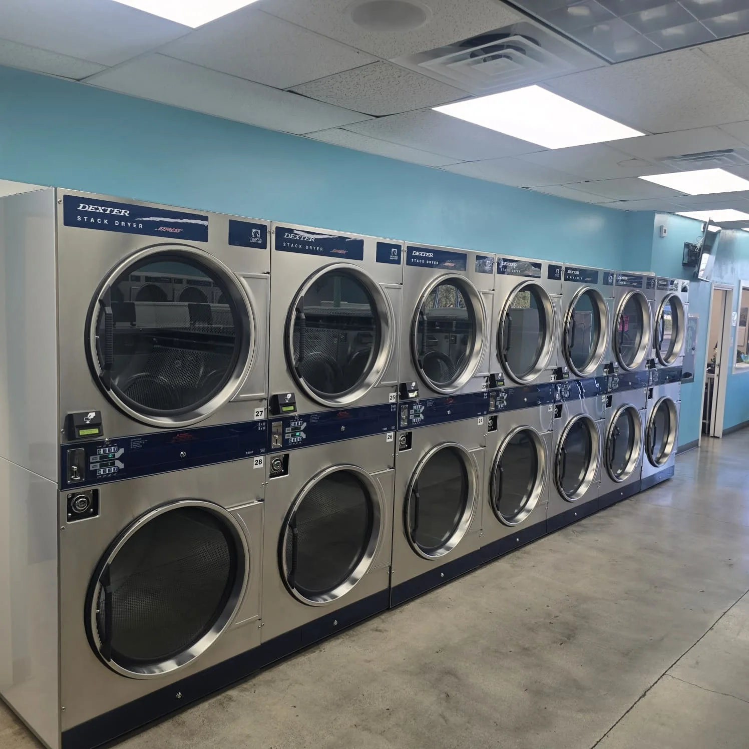 Commercial-size laundry dryers at Laundry Square in Tucson