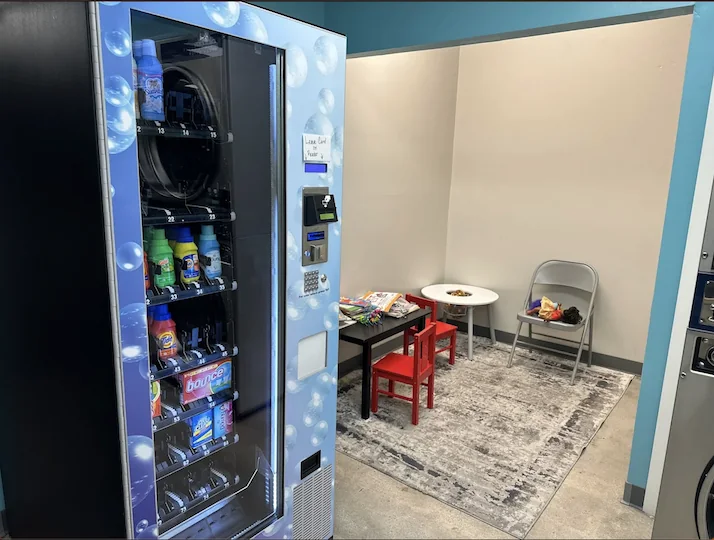 Kids area and laundry supply vending machine at Laundry Square in Tucson